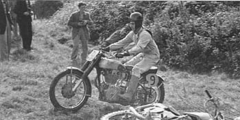 Belgian Victor Leloup (FN) passing a fallen Leslie Archer in 1952